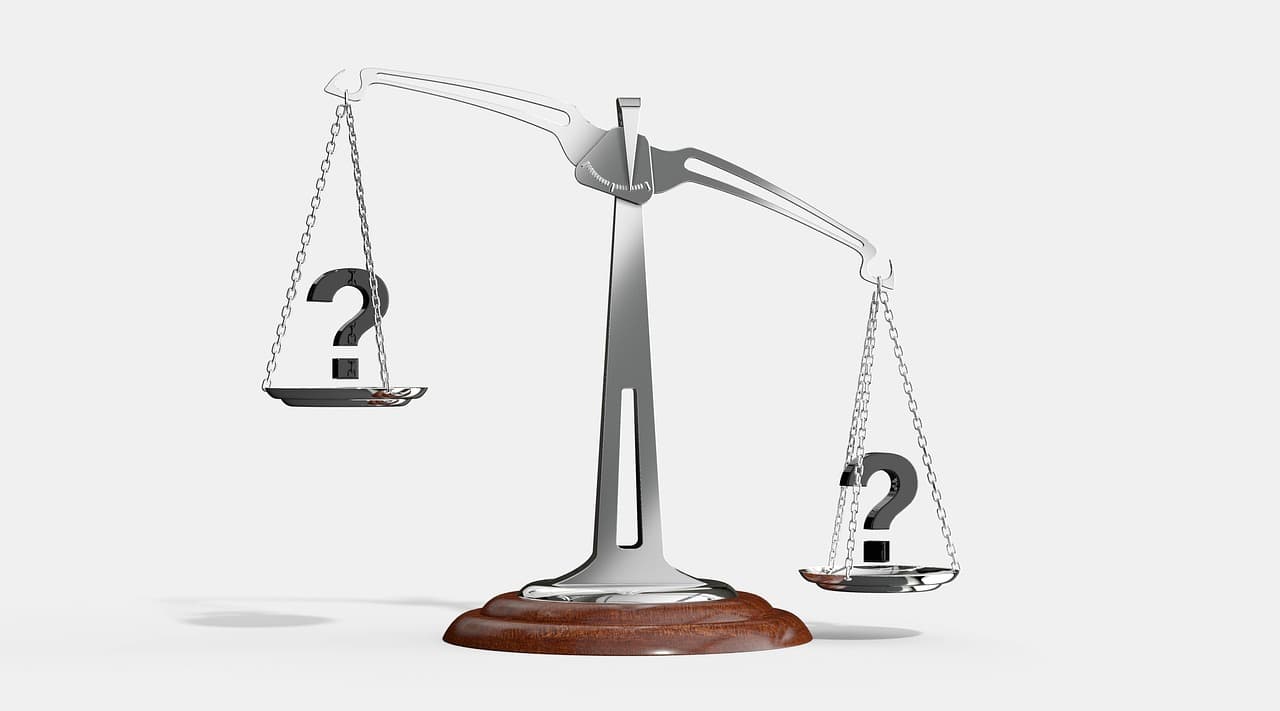 A set of balance scales, representing a comparison between two different tools