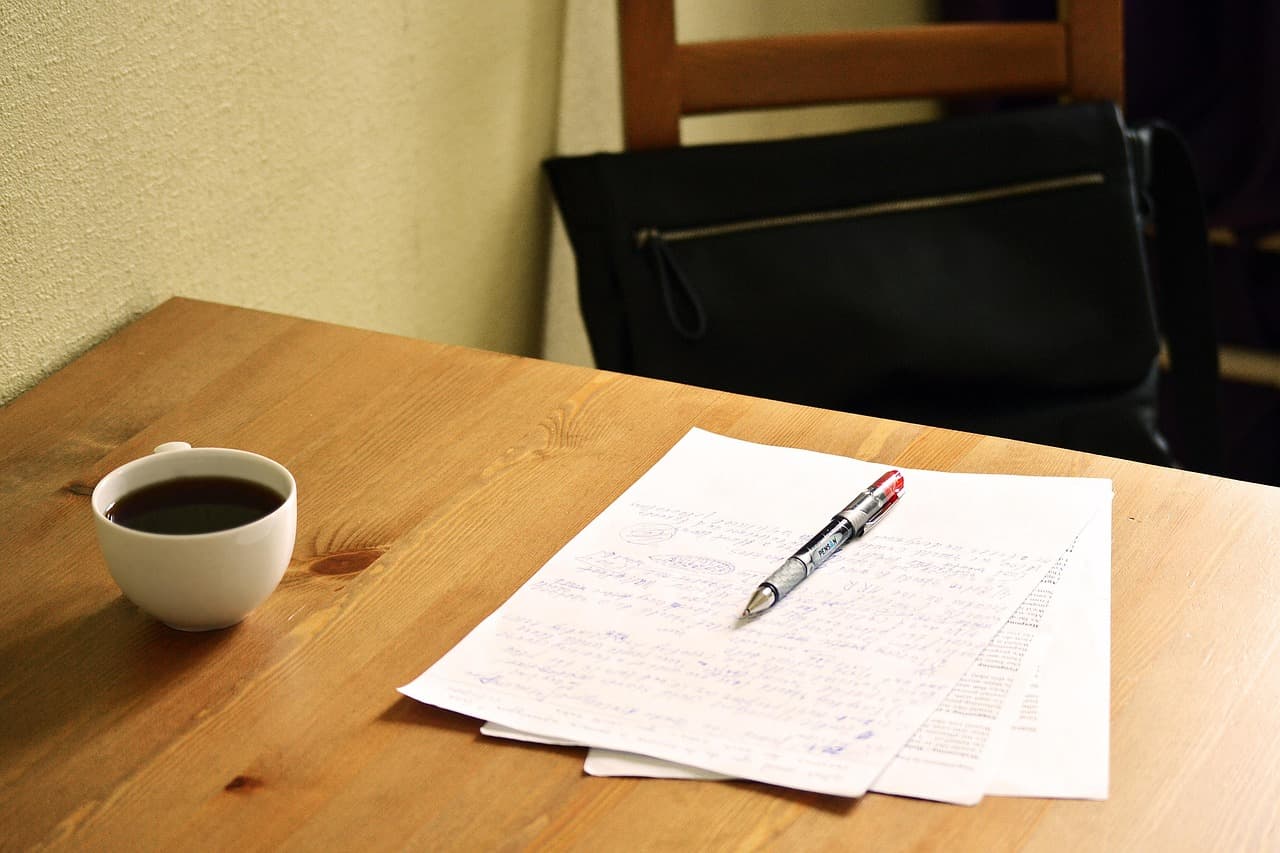Editing marks on a printed page with a red pen